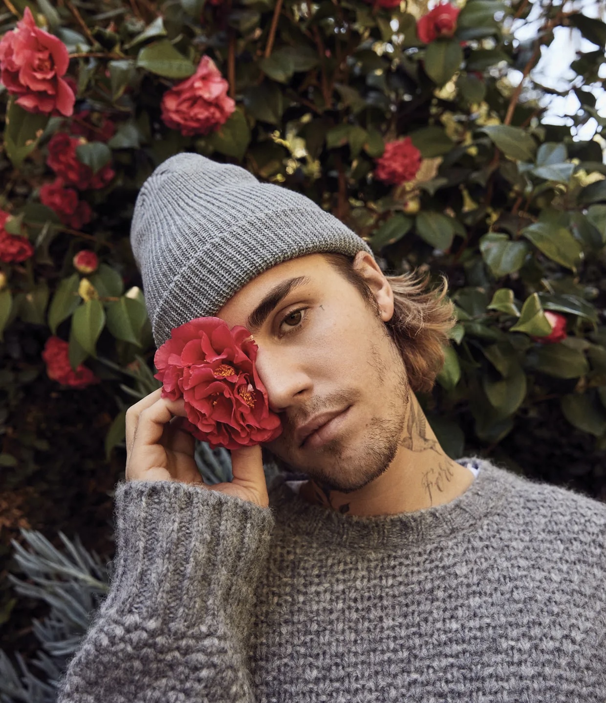 Justin Bieber with a flower